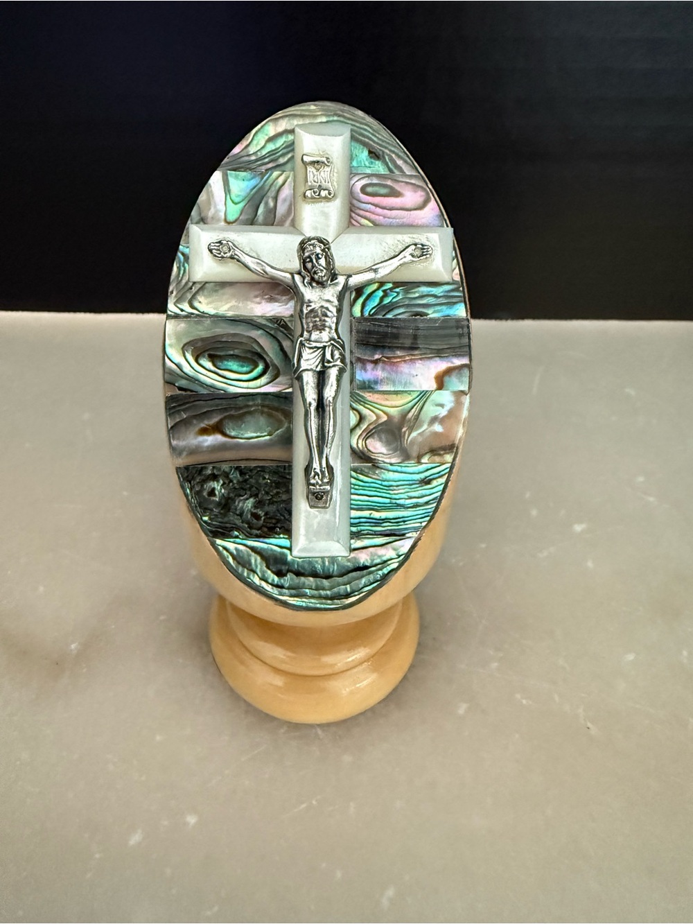 MOTHER OF PEARL CROSS WITH METAL CRUCIFIX ON OLIVE WOOD STAND